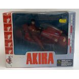 An Akira figurine by MacFarlane toys