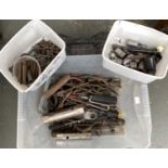 A mixed box of various pliers, other sockets, and hand tools