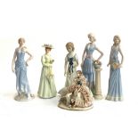 A number of porcelain figures of ladies, to include Meissen figure of a seated girl and dog, 13cmH
