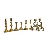 Three pairs of brass candlesticks together with a set of brass fire dogs