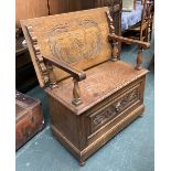 A 20th century oak monk's bench, with carved decoration, 85x46x81cmH