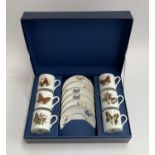 A cased set of six each Royal Worcester 'Butterflies' coffee cans and saucers