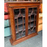 A glazed mahogany bookcase of three shelves, on a moulded plinth base, 102x27x125cmH