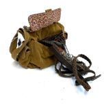 A canvas Fossil bag containing a quantity of dog leads