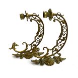 A pair of crescent shaped brass foliate wall sconces 28cm deep