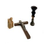 A white metal seal stamp with black onyx glass handle; white metal and wood crucifix; and a