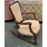 A modern hardwood rocking chair with upholstered seat and back