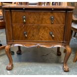 A George II style small chest with slide over two drawers, on cabriole legs with ball and claw feet,