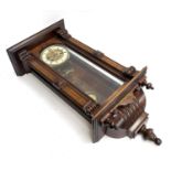 A mahogany and parquetry wall clock, with key, 73cmL