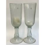 A pair of glass candle holders, 54cmH