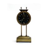 An early 20th century brass gravity clock, visible movement, the glass dial cracked, white painted