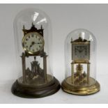 A Kundo torsion clock together with one other, each with glass dome, 22.5cmH and 29.5cmH