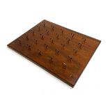 A 25 hook mahogany key rack, 46x35cm