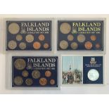 Three cased coin collections 'Falklands Islands Liberation Set 1982'; together with a cupro-nickel