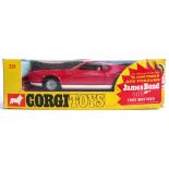 A James Bond Corgi Toys Whizzwheels 391, Ford Mustang Mach 1 in red with opening doors and tilting