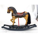 A painted wooden rocking horse, approx. 80cmH 118cmL