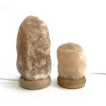 Two salt rock crystal lamps, 28cmH and 17cmH, together with a small quartz crystal, boxed, 11.5cmH