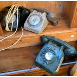 Three vintage rotary dial telephones, one bearing label for Dorchester; together with an oak cased