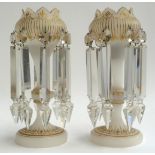 A pair of white opaque glass table lustres with prism cut glass drops and gilt detailing, each 27cmH