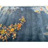 A large blue wool rug with floral decoration, 360x277cm