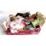 A mixed box of Barbie dolls, convertible car, accessories, etc