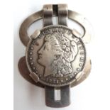 A 1921 silver Morgan US Dollar mounted within a silver money clip
