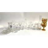 A mixed lot of glass ware to include various wine glasses, champagne flutes, coca cola stemmed