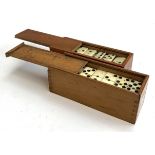 A set of 19th century bone and brass inlay dominoes; together with a further set