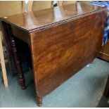 A late 19th/early 20th century dropleaf dining table on ring turned legs, 107cmW