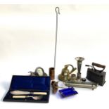 A mixed lot of metal items to include brass bell, copper pitcher marked sherry, metal stirrup