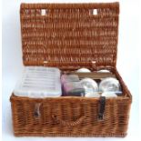 A wicker picnic hamper, 53cmW, containing a quantity of cutlery, straws, place mats, ramekins etc