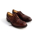 A pair of Tricker's brown leather brogues with wooden tress, size 11