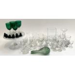 A mixed lot of glassware to include numerous port and sherry glasses, a set of six green glass
