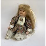 A china doll, marked 9386A