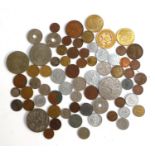 A tin containing a collection of British and foreign coins to include, Fiji penny 1936, 1952,