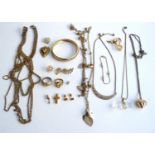 A mixed lot of gold tone costume jewellery to include bracelets, pendants etc