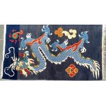 A small Chinese blue dragon wool rug, 94x164cm