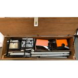 A plywood box containing a quantity of photographic lighting equipment, to include a pair of Power