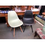 A pair of Eames style plastic and beechwood chairs