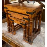 A nest of three eastern hardwood and metal bound occasional tables, the largest 45cmW