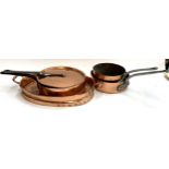 Four Victorian copper and steel handled pans, the largest approx. 29cmD, with lid; together with a