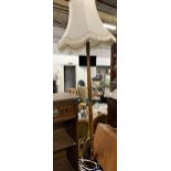 A turned wood standard lamp with shade, 170cmH to top of shade,