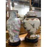 Two ceramic baluster table lamps with floral design in hardwood bases, the tallest 44cmH to top of