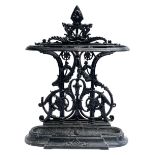 A cast iron stick/umbrella stand with removable drip tray, 75cmH