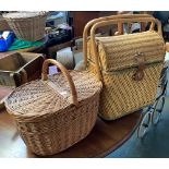 A wicker picnic hamper together with two other wicker baskets