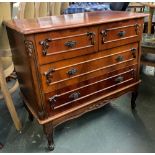 A 20th century chest of drawers, moulded top over two short over two long drawers, applied