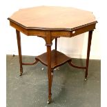 A shaped octagonal occasional table, on square tapered legs, with shaped undershelf and brass