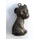 A silver baby's rattle in the form of a dog, hallmarked W.H Collins & Co, Chester 1959, 5cmL,