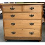 A light oak chest two short over three long drawers, on plinth base and turned feet, 107x46x107cmH