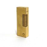 An engine turned gold plated Dunhill lighter